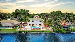 Experience luxury living with stunning views and a private pool by the canal.