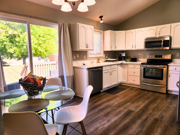 Kitchen with door directly to back yard deck