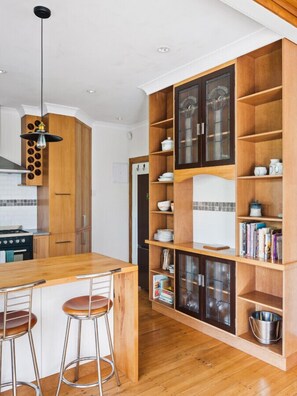 Kitchen with gas stove, microwave and cookings basics