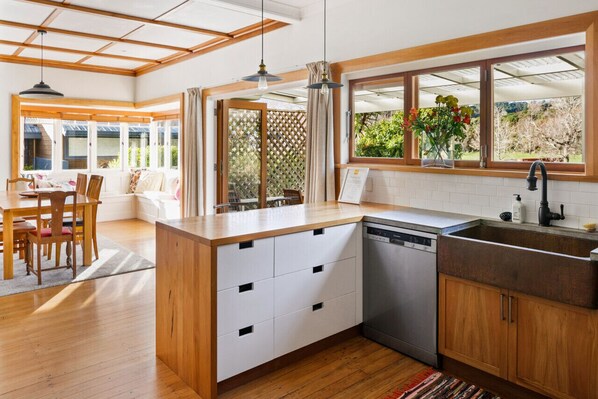 Kitchen with gas stove, microwave and cookings basics
