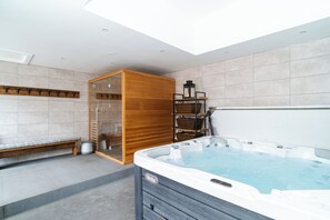 Luxurious spa building with a dry sauna & hot tub