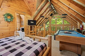 loft with bedroom and pool table