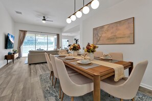 Dining flows to living and pool