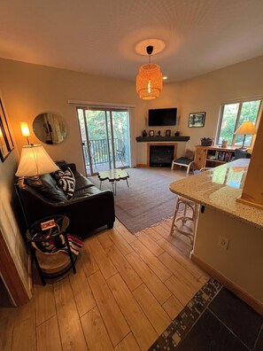 Livingroom with comfy couch that pulls out to a queen size bed.