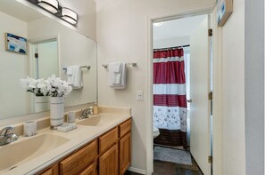 Jack and Jill sinks with separated shower/toilet for convenient use by 2 people.
