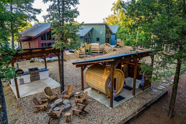 Our shared property amenities include an 8-person barrel sauna, cold plunge, gas fire pit, dual-purpose pickleball/basketball court, golf putting green, library, store, and a fully equipped outdoor kitchen. Please be a good neighbor—our team ensures these