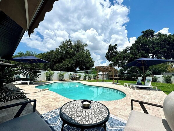 Gorgeous Backyard with Pool & Hot Tub (Not Pictured), Loungers, Umbrellas, and ample Seating