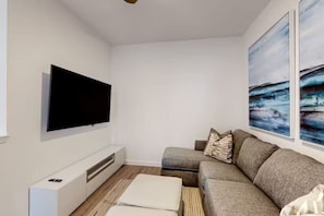 Cozy den area with a sofa bed, ideal for lounging or extra sleeping space.