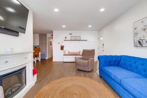Living Room with 2 lazy boy recliners and electric fireplace.
