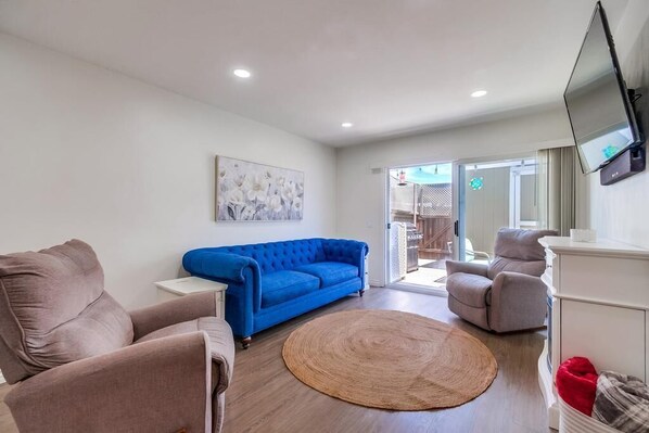 Living Room with 2 comfortable Lazy Boy recliners, sofa & electric fireplace.

