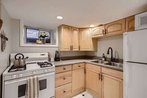Light wood and granite countertops complement the kitchens rustic charm