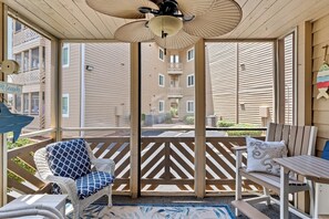 Have your morning coffee on the furnished screened-in porch.