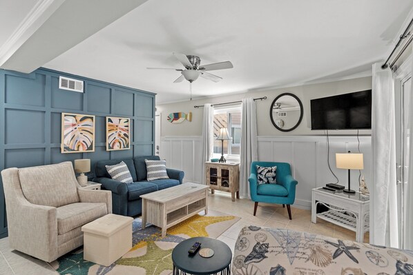 This comfy living room offers space for everyone to gather!