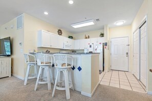 The kitchen counter provides additional space for serving snacks or meals.