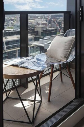 Sit out on the balcony and watch the city below move by day and night while enjoying your morning coffee or a glass of wine in the evening.        