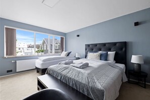 Experience ultimate comfort in the second bedroom, featuring a luxurious king-size bed and a single bed, both equipped with high-quality mattresses and first-class linen.