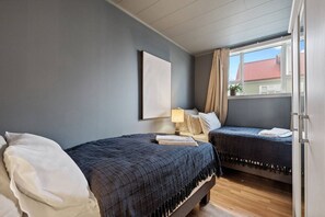 Find your perfect sleeping arrangement in this cozy and well-appointed two-bed bedroom retreat.