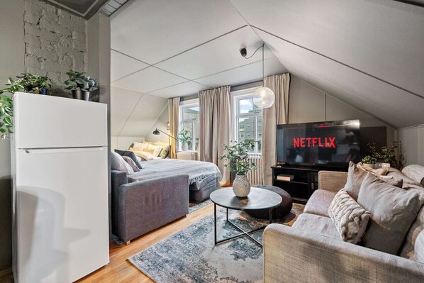 Experience the Ultimate Comfort in our Cozy Couch and Big TV Living Room