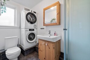 The versatility of a laundry room and a bathroom all in one.