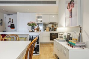 The apartment's interior matches the trendy and artsy location of Collingwood, complete with plenty of art, small touches and reading materials for your stay