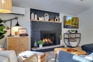 living room: gas fireplace (remote operated), 65" Smart TV, record player