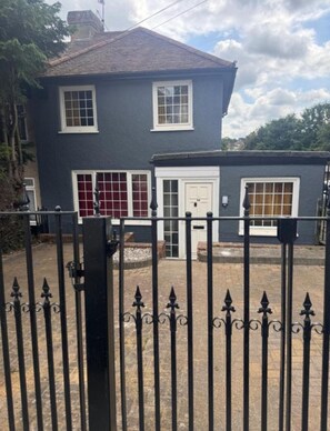 Property entrance with gated driveway