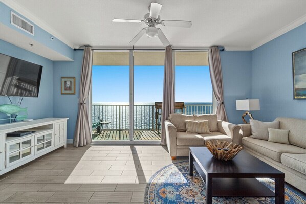 Our cozy living area with access to the balcony  where you can enjoy the beach view
