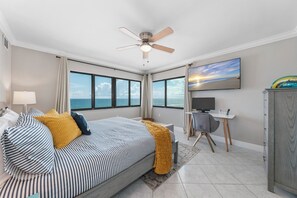 The oceanfront master bedroom has a king bed, large TV, desk with a USB cable, and a gorgeous Atlantic Ocean view