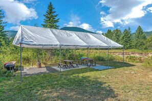 Summer time amenity includes a pavilion with picnic tables for outdoor dining and entertainment