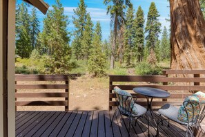 Back deck with forest scnerey.
