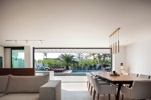 The dining table featuring 10 chairs, makes the perfect setting for intimate dinners with your loved ones