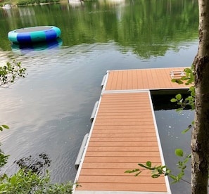 Private dock with boat hooks and ladder.
