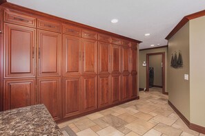 Entryway cabinets leading into the laundry area.