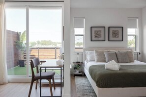 spacious primary suite has a resort like feel.