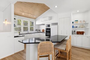 The kitchen is perfect for passionate cooks and social gatherings