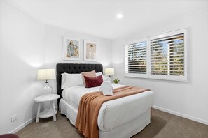 Contemporary art and soft lighting provide a soothing atmosphere in every bedroom