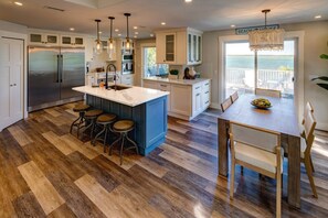 The beautiful and spacious kitchen is a chef's dream, featuring modern appliances and plenty of counter space for meal preparation.