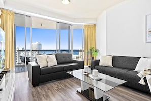 Spacious living area overlooking the ocean and the city