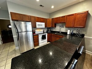 Cook up a feast in our cozy kitchen, fully equipped with everything you need!