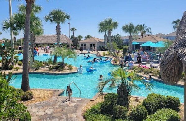 Oasis Clubhouse Pool and Tiki Bar - Come relax at the desired Oasis Clubhouse, all amenities included with this property.  From this beautiful Villa it is walking distance to the Clubhouse that offers, a bar, restaurant, movie nights, bingo, pools, lazy river and much more!