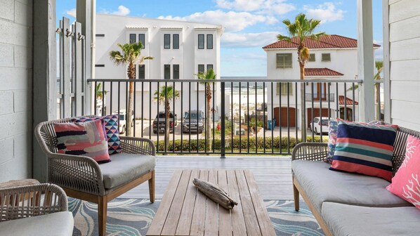 The shaded balcony lets you enjoy some fresh air, minus an impending sunburn. 