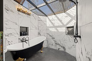 Luxurious custom shower with freestanding tub