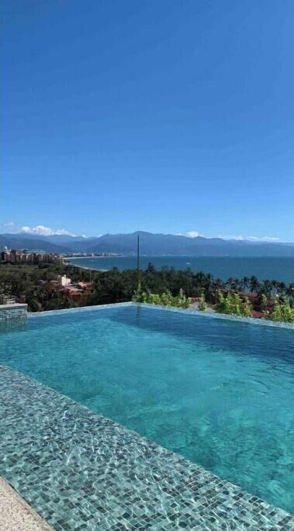 Enjoy incredible views from our roof top infinity pool next to the jacuzzi