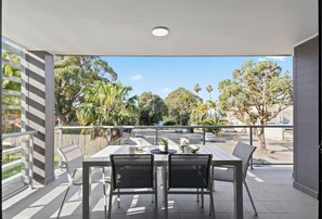 Enjoy al fresco dining on this stylish balcony, where you can savour meals and unwind with a view.