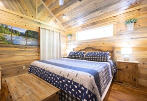 Drift off to sleep in this cozy bedroom, featuring warm wood accents and a comfortable bed.