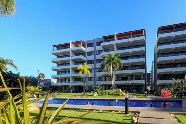 Tower C. Our unit is on a 2nd level facing the swimming pool. Elevator available
