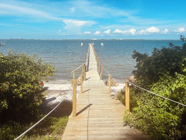 Walkout to private beach, boat dock, outdoor shower & cleaning station.