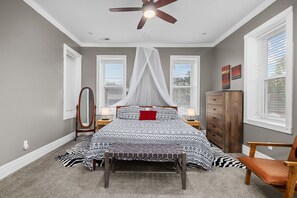 Master bedroom  king bed. Out of Africa decor for romantic evenings.  Spacious