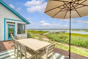 Fully furnished back deck, includes a table with seating for 6. Enjoy the view while enjoying a meal with your group.