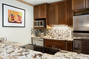 Updated Kitchen with Granite Countertops, Refrigerator with Icemaker, Microwave, Dishwasher, Oven and Induction Cook Top.